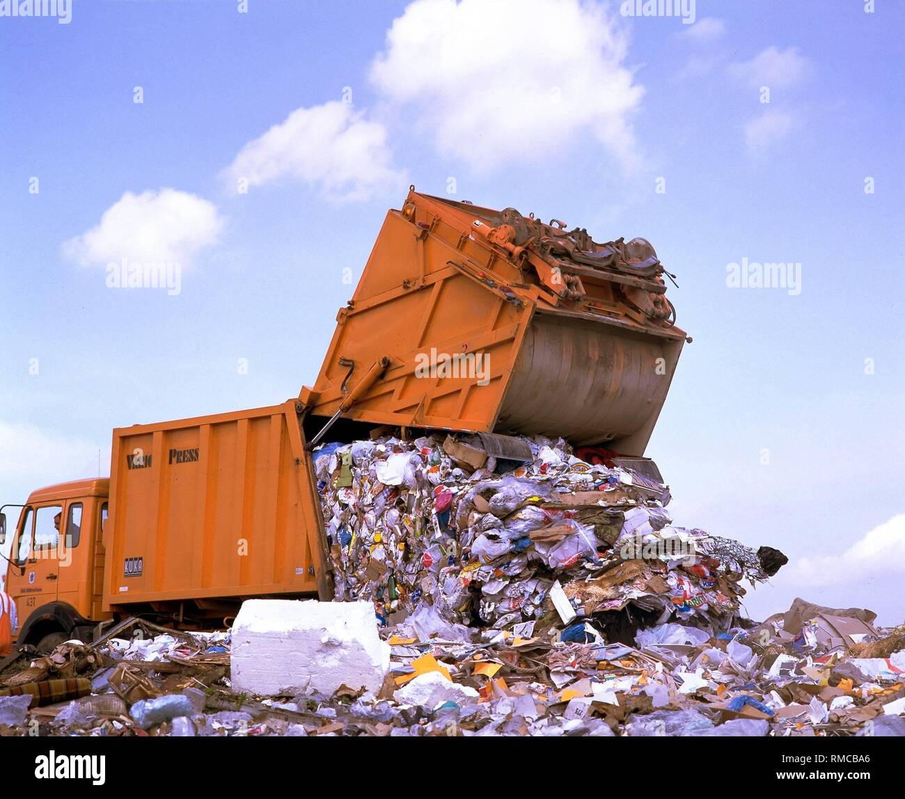 Garbage truck unloading waste at a garbage dump in North Rhine ... Garbage truck unloading waste at a garbage dump in North Rhine ...